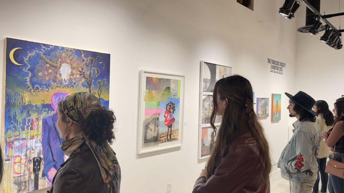 Students from various art classes at RCC observes their professors' artworks on display March 2.