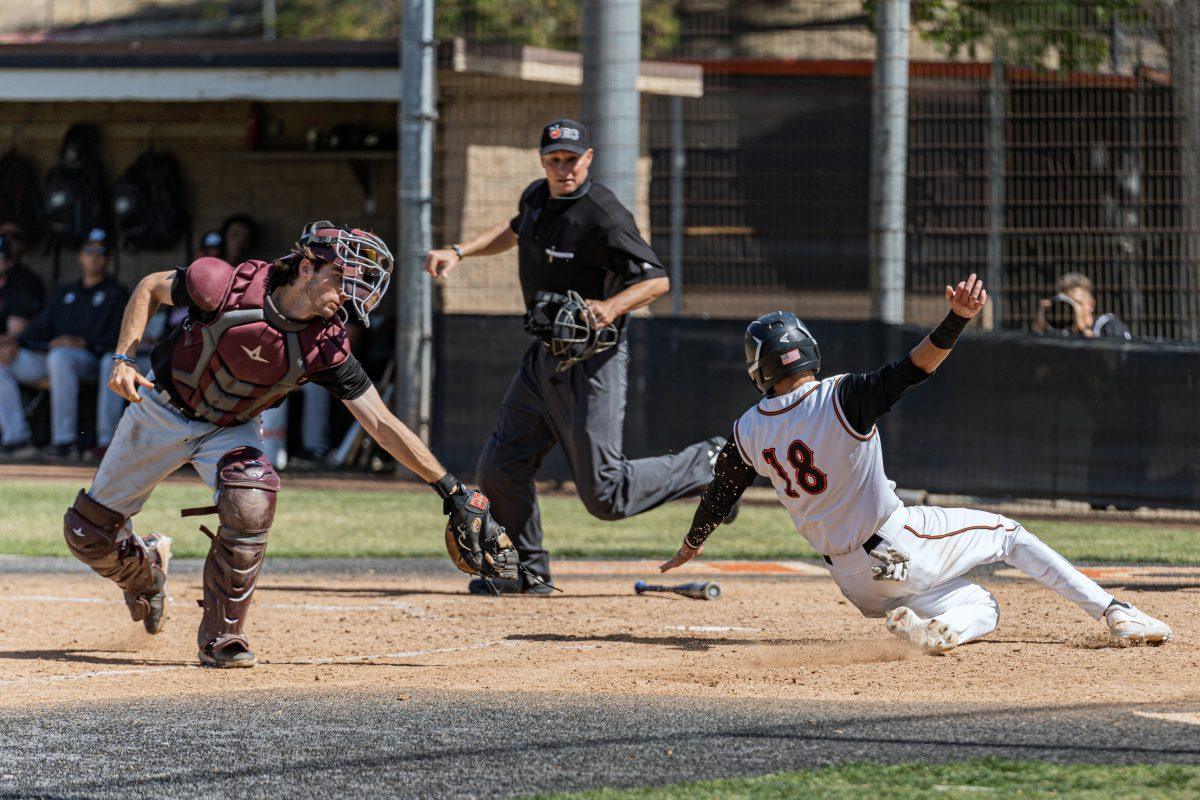 Riverside City College Tiger Jerrad Gonzalez avoids the catcher and slides into home putting a run on the board during the game against the Saddleback College Bobcats on April 27.

Tigers defeated the Bobcats 11-8.

Photos by Stephen Day, Viewpoints.