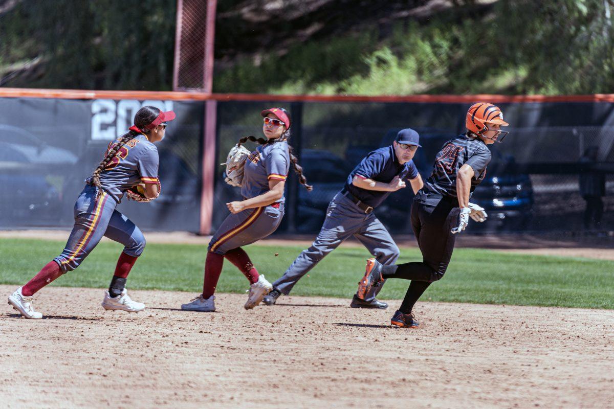 Riverside City College Tiger Alexis Pelayo gets caught in a pickle and looks for a way back to first base.  Pelayo was tagged out during the game with the Pasadena City College Lancers on April 1.

Tigers lost to the Lancers 7-4.

Photo by Stephen Day, Viewpoints