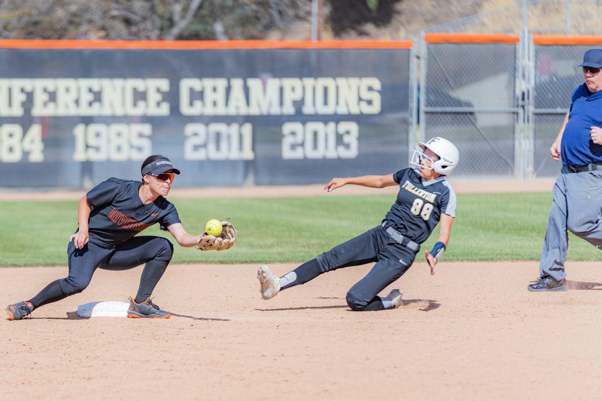 Riverside City College Tigers suffered from a series of errors throughout the game, like this one where Sarah Franco-Colis ended up dropping the ball allowing for the runner to reach second base safely at the game against Fullerton College Hornets at the Evan's Sports Complex on April 20.

Tigers were defeated 6-2.

Photo by Stephen Day, Viewpoints.