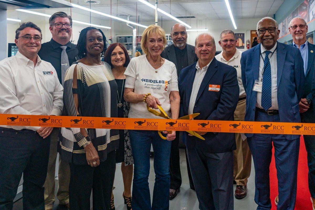 Janet Steiner cuts the ribbon at the unveiling of the new million dollar printing press at the Technology B and Print shop on April 21. Photos by Mathew Acosta. Viewpoints