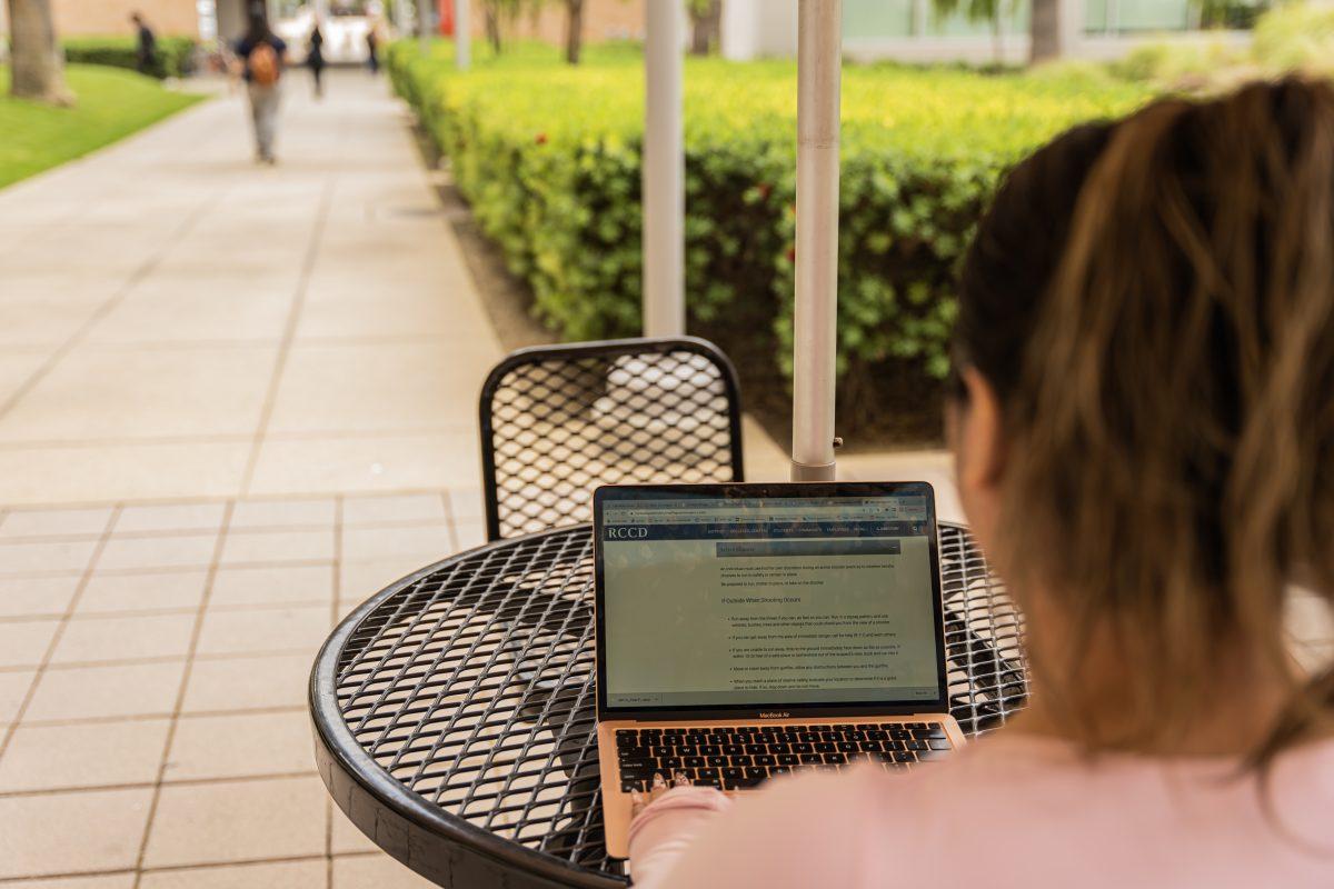 A Riverside City College student reviews the sparse and inconsistent information regarding policies and procedures during an active shooter incident on campus that RCCD provides on its website on May 10 at RCC.

Photo by Stephen Day, Viewpoints.