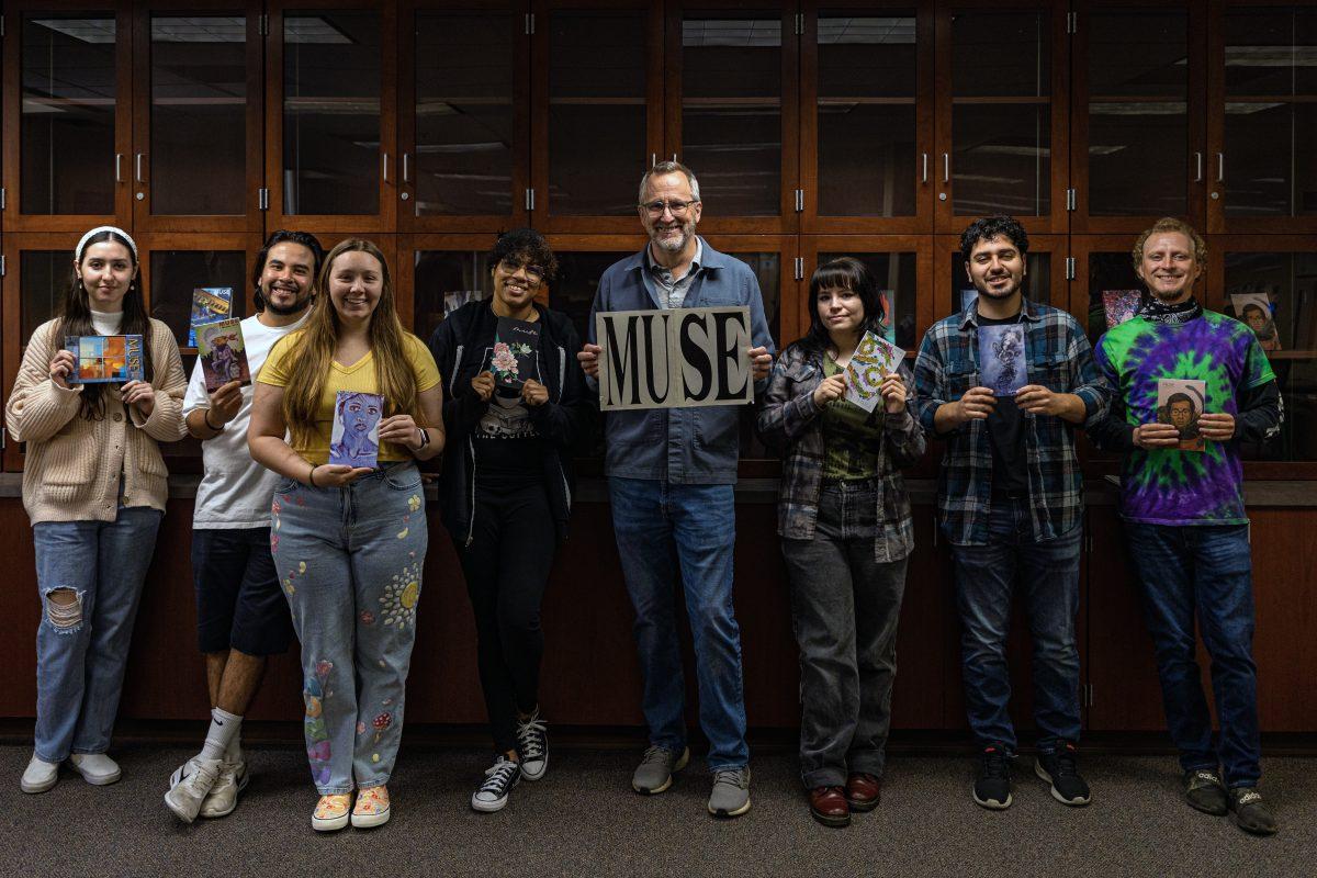 Professor James Ducat, and the editing team from MUSE hold copies of previous books MUSE has published in their new space in the Writing and Reading Center (WRC) in the Martin Luther King Building at Riverside City College on May 24.

Photo by Stephen Day, Viewpoints.