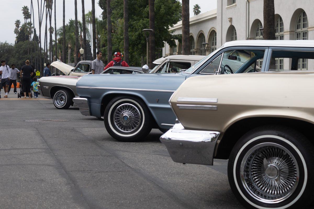 Low angle shot of multiple Low Riders front sides at the Riverside City College Low Rider Show on Miné Okubo Avenue & Terracina Drive on Sept. 21. (Adrian Taylor | Viewpoints)