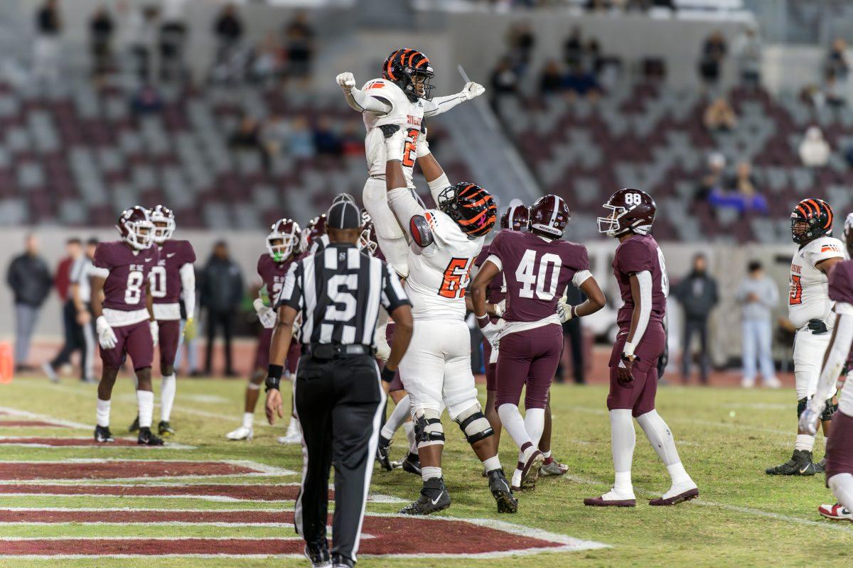 Riverside City College Tiger wide receiver Bryce Strong celebrates another touchdown by being lifted in the air by his teammate  during the SCFA semi-final game at Mt. SAC's Hilmer Lodge Stadium on Nov 25.

Tigers defeated the Mounties 51-48.

Photo by Stephen Day, Viewpoints.