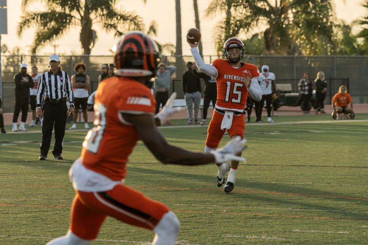 Riverside City College Tiger quarterback Jordan Barton finds wide receiver Jacqueze Modica for the completion during the SCFA Championship game against the Ventura College Pirates at the Ventura College Sportsplex on Dec. 2.

Tigers won 45 - 26 and will advance to the state championship.

Photo by Stephen Day, Viewpoints