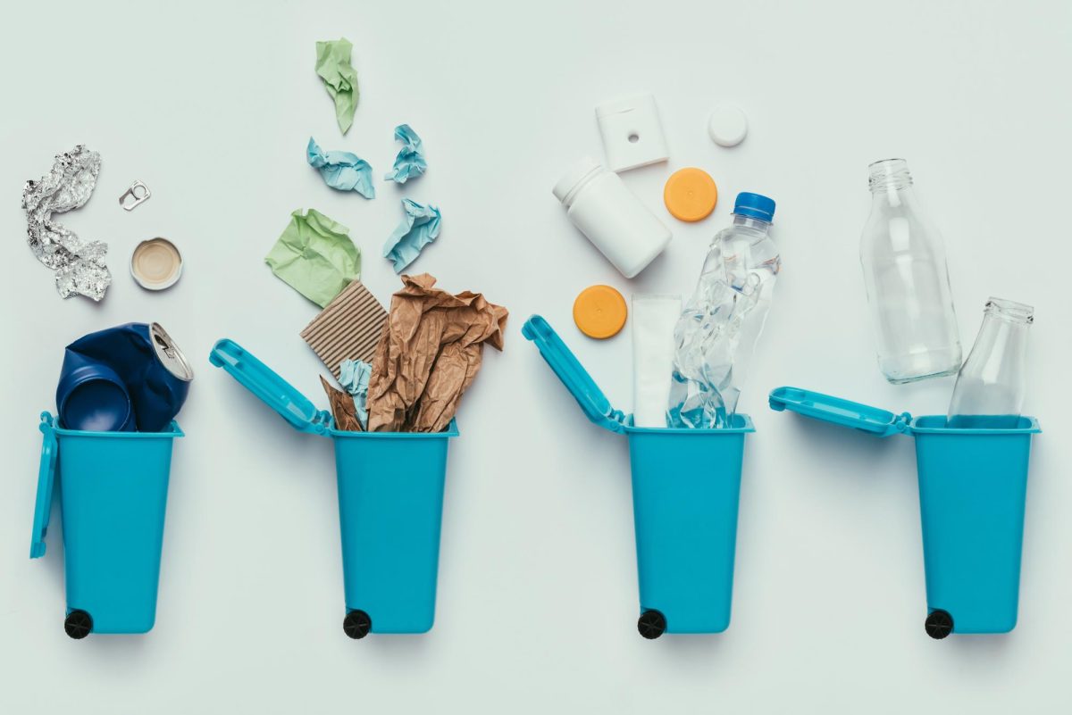 Stock photo of recycling bins separated by material, courtesy of Adobe Stock.