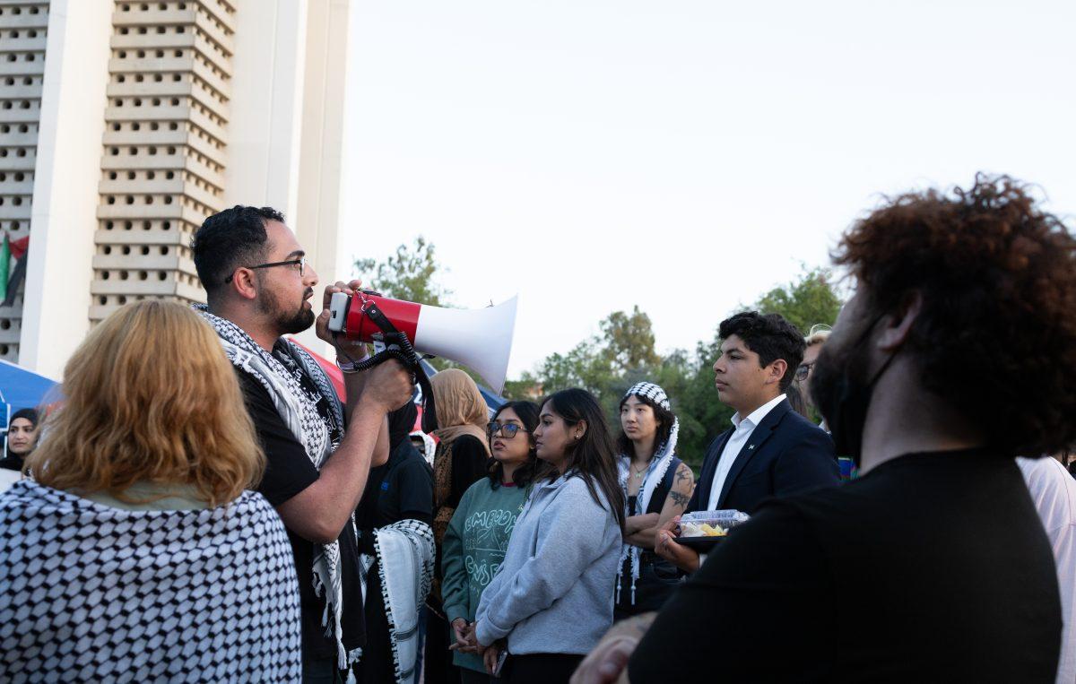 A group of students taking a break from protesting and chanting at the encampment on May 1.