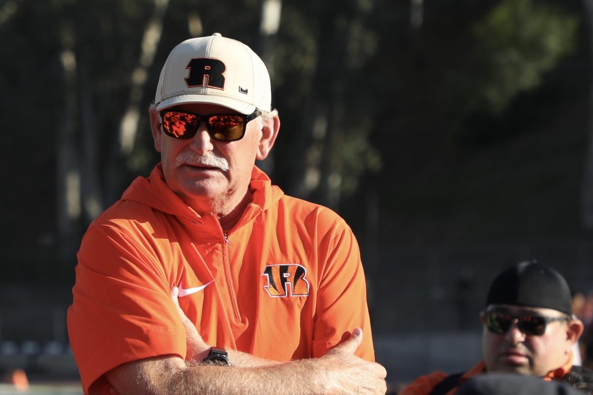 Riverside City College head football coach, Tom Craft, gathers the football team to discuss their Oct. 26 win against Southwestern College at Wheelock Stadium.