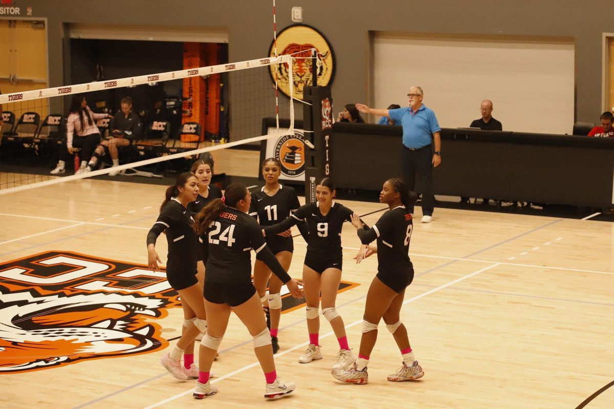 Riverside City College Volleyball players celebrate after scoring on Oct. 23 at the Wheelock Gymnasium.