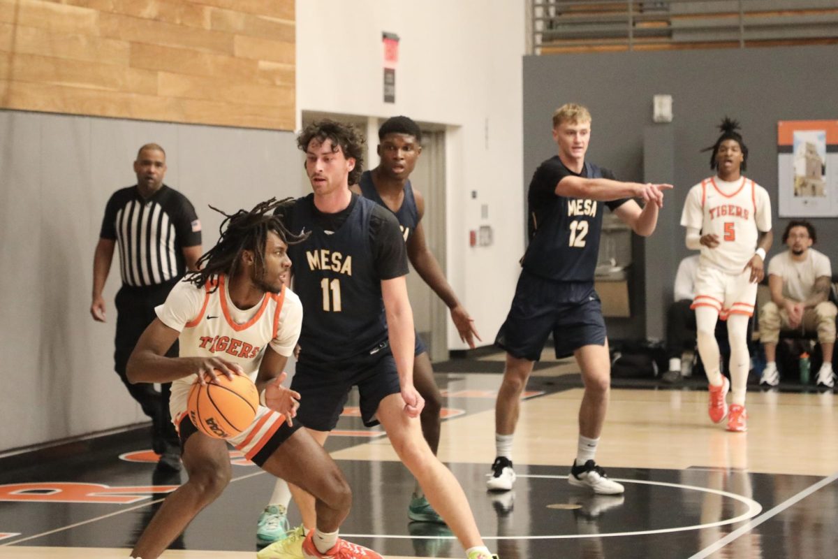 Riverside City College basketball player Andre Skelin, a forward-center, rushes to score as San Diego Mesa College players Jett Wilson, Chanel Mballa and Luciano Casini attempt to block him during the Nov. 6 game at Wheelock Gymnasium. 