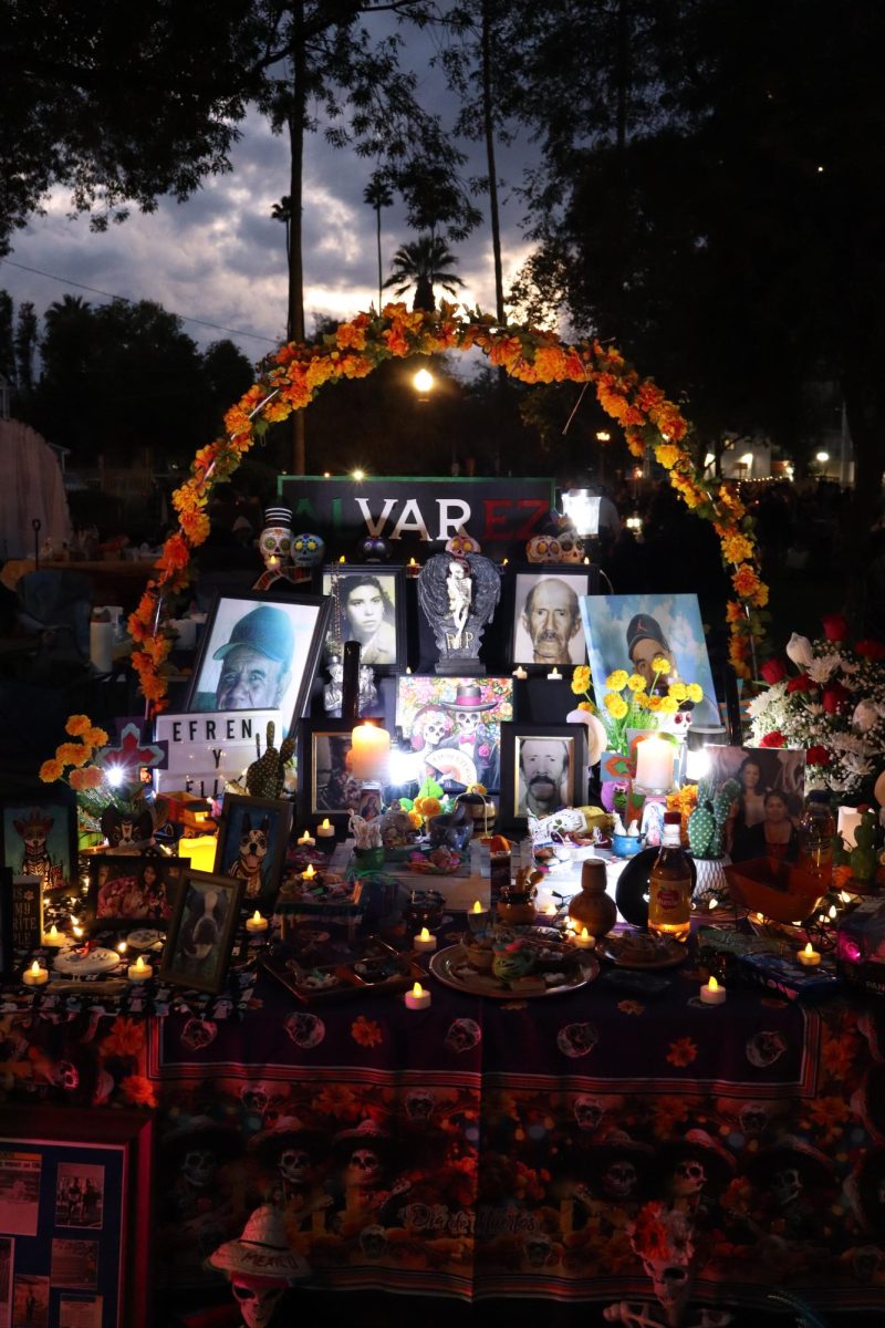 The Trujillo and Alvarez family display an altar for their loved ones who have passed away to remember them in White Park for Downtown Riverside Day of the Dead 21 annual festival.