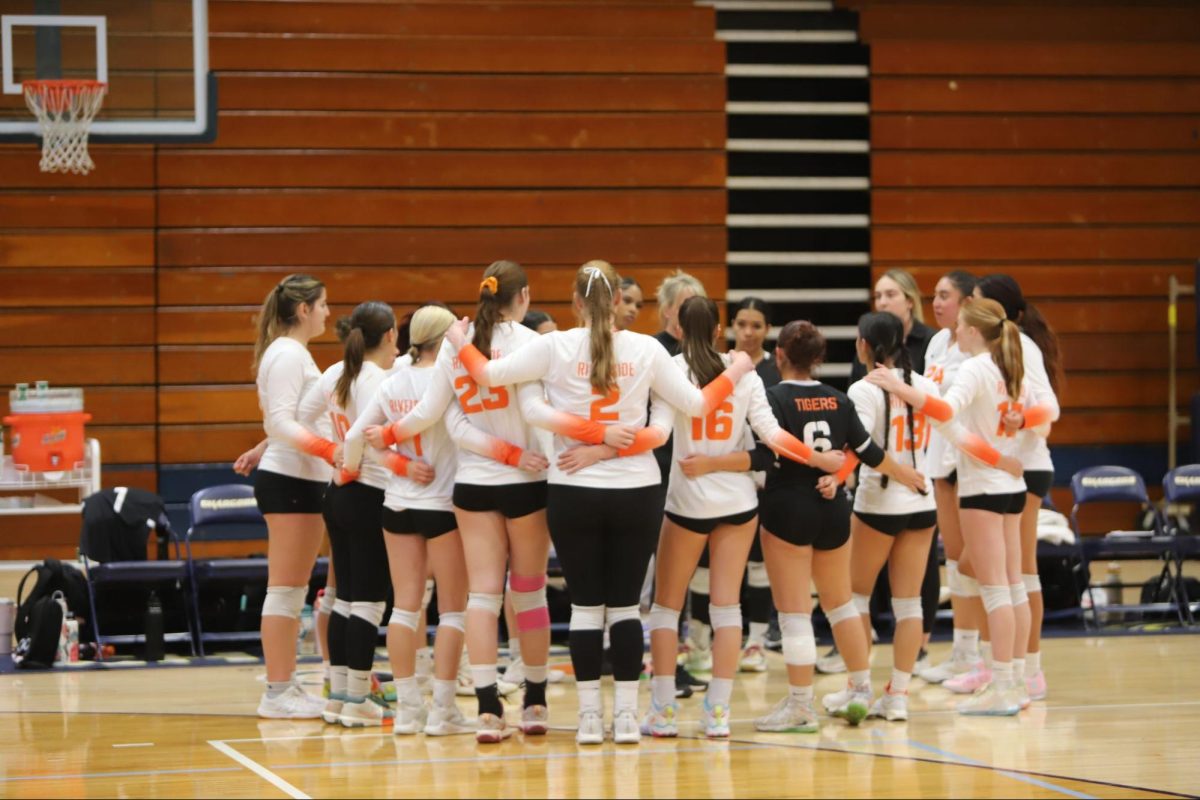 The Riverside City College Tigers huddle around head coach, Clara Lowden, on Nov.6 at Don Johnson Gymnasium.
