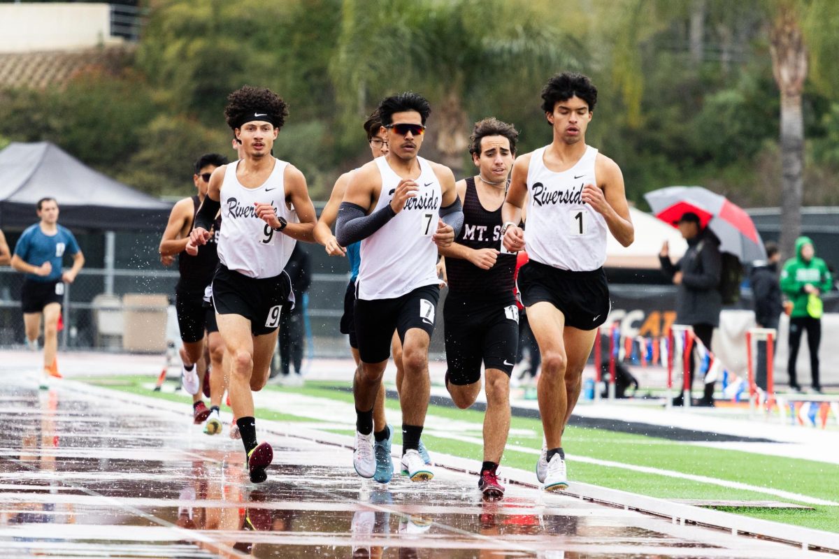 Riverside Athletes leading the pack in the 4th heat of the Men’s 1500-meter race, from the left Alexander Mota, Sergio Cantillano, and Roberto Granados at Wheelock Stadium on March 14