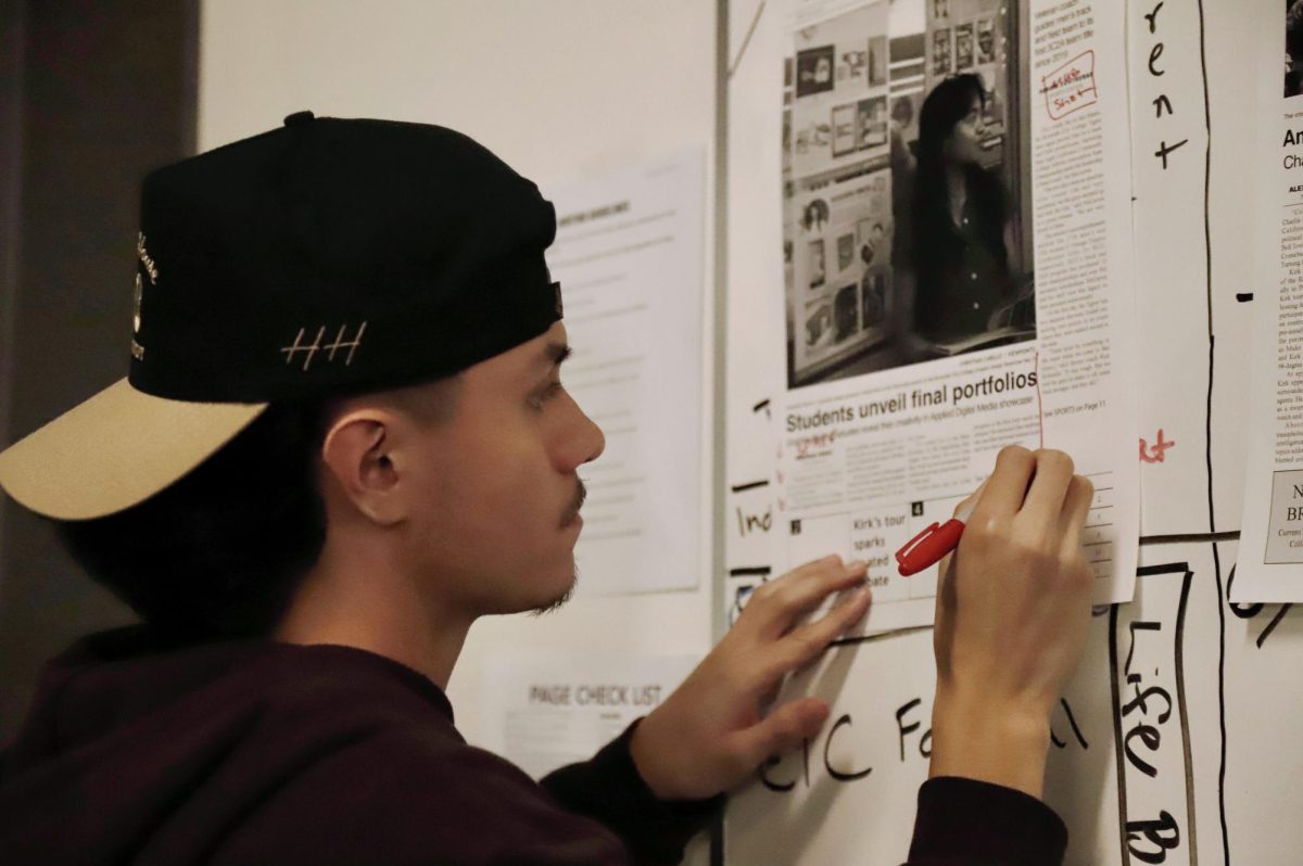 Viewpoints Editor-in-Chief Eric Pacheco works on copy editing a page
during press week in the Viewpoints newsroom.