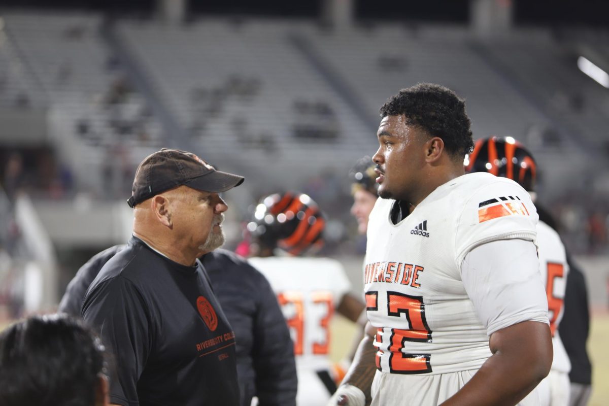 Offensive Line Simion Maiava taking direction during the 2024-25 football season