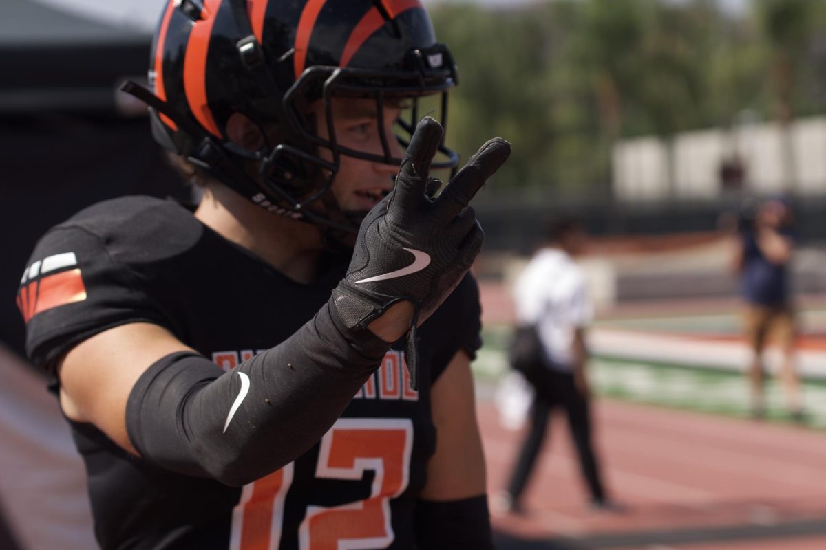 Riverside City College defensive back, Matthew Lashley, holds up the number of interceptions he caught during the game against Palomar College on Sept .27.