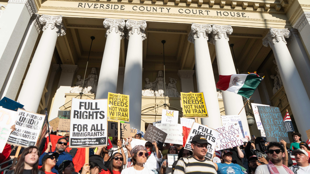 Protesters stand in front of the Riverside Courthouse during the nationwide 'No Kings' protests on June 14.
