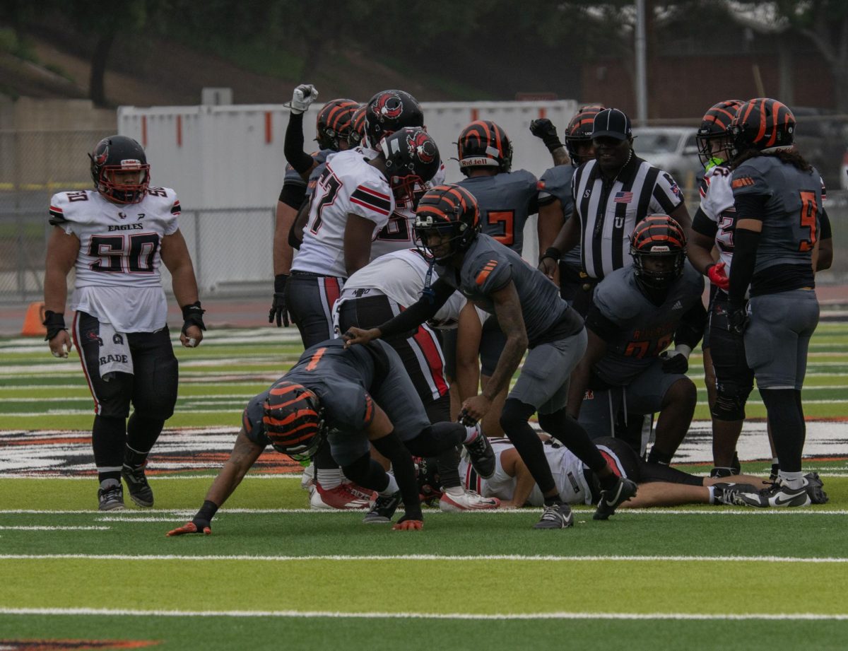 Riverside City College linebacker, Micah Valenzuela (1), celebrates with the assist of defensive back, Sha'Heem Taylor (5), after tackling Mt. San Jacinto quarterback, Cole Vasquez (4), on Oct. 25. 