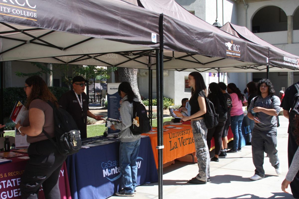 Universities representatives share flyers and information to students at Riverside City College at a Transfer fair on Sept. 25.