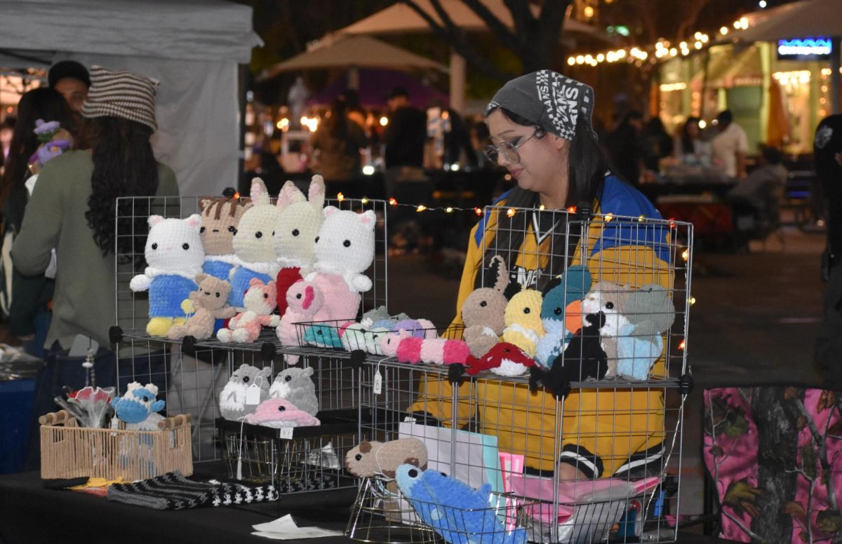 Elle Garcia sells her crochet goods at the Riverside Artswalk on March 6. 