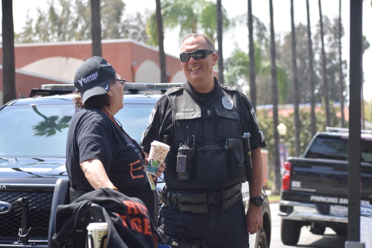 Sgt. Octavio Rojas interacting with an RCC student during the job fair on April 9. 