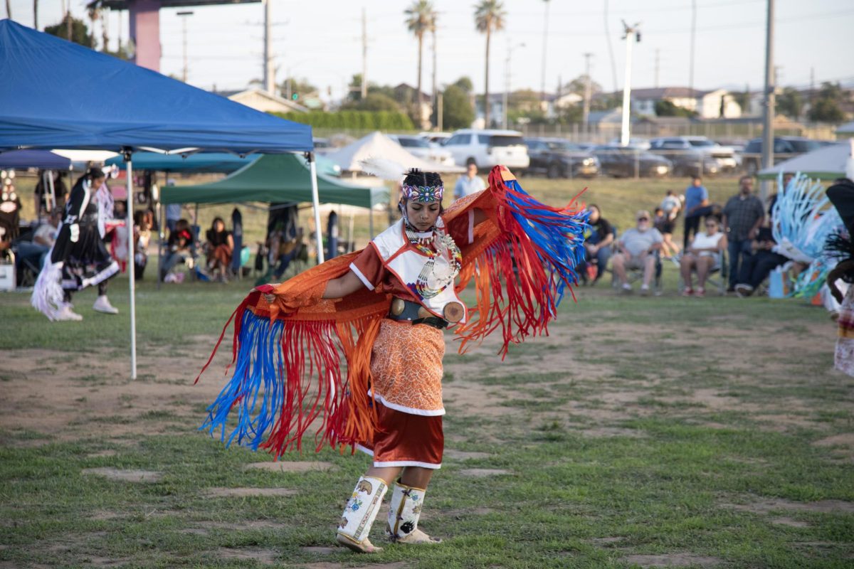 A teen girl fancy dancer works her way around the circle to display her dance for each judge at the 40th Annual Youth Powwow at Sherman Indian High School on April 18.
