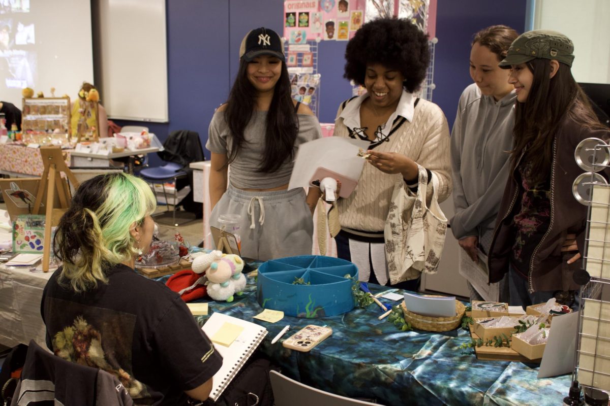 Pamela Mondragon showcases her fish art collection at Riverside City College 'Tigercon' on April 29.
