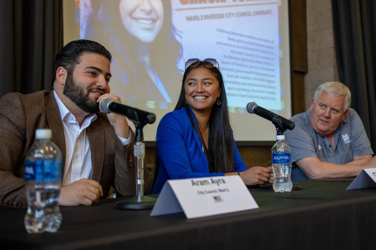 Riverside City Council candidates for Ward 2 talk during intermission of voter education town hall in the Bradshaw Cafeteria on May 6.